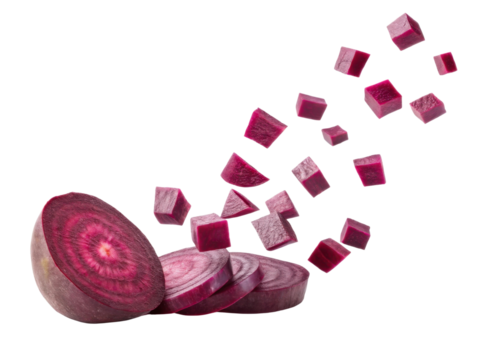 Fresh beetroot slices and cubes create vibrant display of color and texture, showcasing rich purple hues and earthy appeal of this nutritious