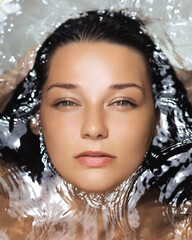 Woman s Face Floating In Water With Soft Light And Clean Skincare Look