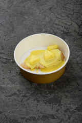 chicken steak baked with cheese in a disposable dish