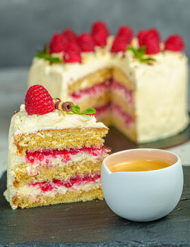 Slice of White Chocolate Raspberry Cake with a Cup of Espresso