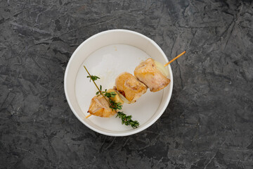 fried kebab on a wooden skewer