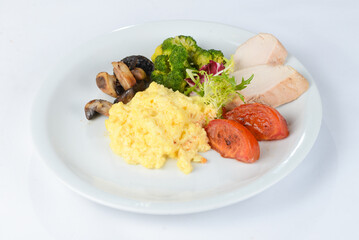 Couscous porridge with mushrooms, fillet and tomatoes