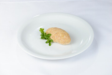 fish cutlet on a white plate