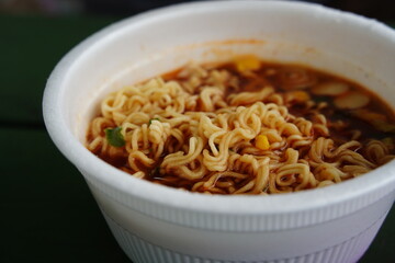 Close-up of instant ramen noodles in a styrofoam cup