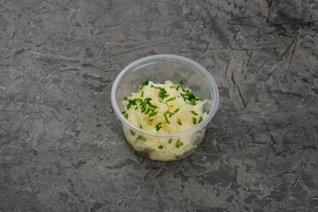 sauerkraut in a single pink bowl on a gray background