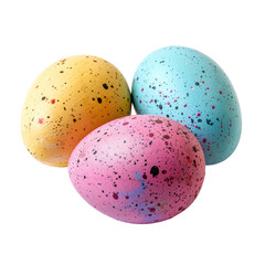 Three speckled eggs in pastel colors,  yellow, pink, and light blue,  grouped close together