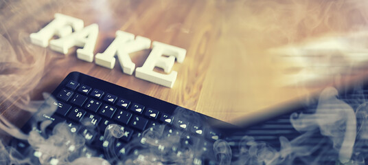The concept of modern information technology. Fake and facts in the news. The letters spelled the...
