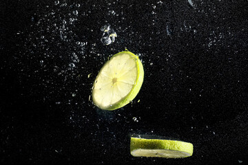 Water drops on ripe sweet lemon. Fresh lime  background with copy space for your text. Vegan...