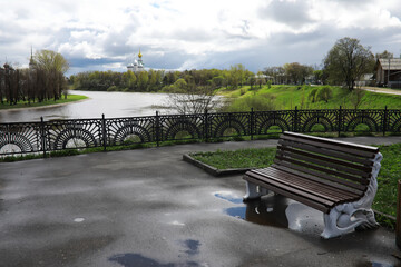 Bench in a park on a sunny autumn morning. Morning walk.