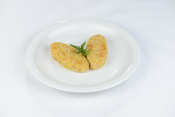 two cutlets on a white plate