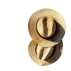 Two straw hats stacked, top view.  Natural light