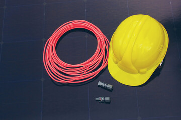 Solar Installation Tools and Safety Equipment on Solar Panel Surface