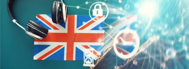 Background concept polyglot. Headphones and flag. The study of foreign subjects. Audiobooks in a foreign language.