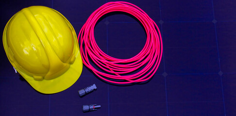 Solar Installation Tools and Safety Equipment on Solar Panel Surface
