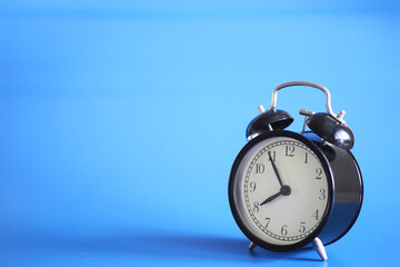 Alarm clock on the table. Time concept. Being late for work and school.