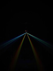 Rainbow light beams converging towards a bright point spectrum dark