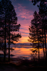 Golden Hour Symphony: Embracing the Splendor and Serenity of Nature's Twilight Canvas Over Tranquil Waters Under a Majestic Yellow Sunset