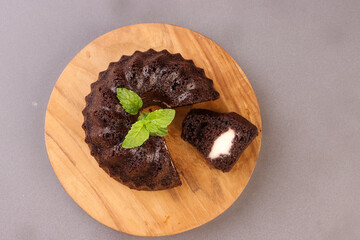 Black Glutinous Rice Bundt Cake With Cheese Filling or Bolu Ketan Hitam Keju Lumer.