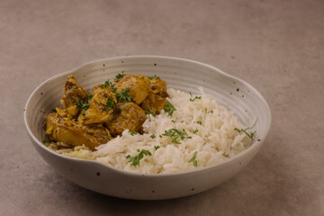 Chicken Korma is Chicken with a Sauce Made From Yoghurt  and Almonds Served with Rice. 