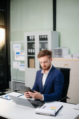 confident businessman works on analytics, financial reports, and strategy. Success, accounting, and teamwork