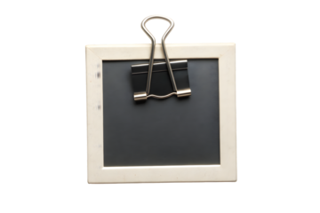 Vintage Polaroid instant photo frame with black binder clip isolated on transparent background