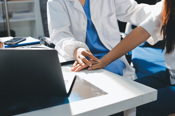 The doctor is checking and encouraging the patient.