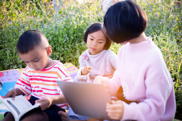 Kids exploring in forest with a magnifying glass