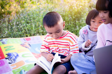 Kids exploring in forest with a magnifying glass