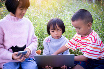 Kids exploring in forest with a magnifying glass