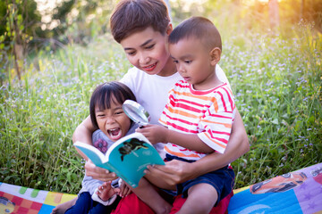 Kids exploring in forest with a magnifying glass