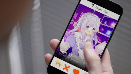 Person looking at waifu dating app with cute anime girl matches on smartphone, over shoulder view