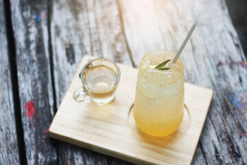 A refreshing iced orange drink garnished