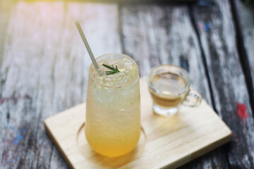 A refreshing iced orange drink garnished