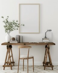 Minimalist home office desk with a wooden trestle desk. a white chair. a vase with green branches. books. a lamp. and a blank poster frame