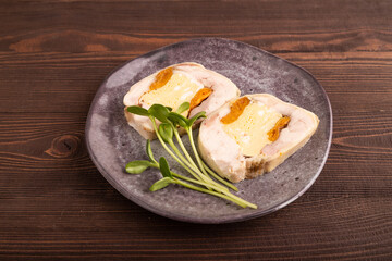 Chicken, egg and dried apricot meatloaf, microgreen on brown wooden. Diet, healthy eating. side view, close up