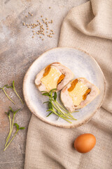 Chicken, egg and dried apricot meatloaf on brown concrete. Diet, healthy eating. top view, close up