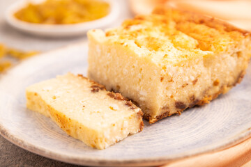 Сottage cheese Сasserole, Curd cake, with dried apricots and raisins on brown concrete, side view, selective focus