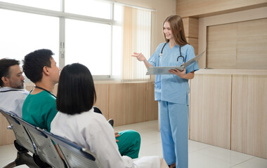 Team Doctor listening medical Caucasian woman student present at hospital	