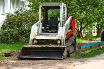 Bulldozer tractor with rubber tracks during excavation work