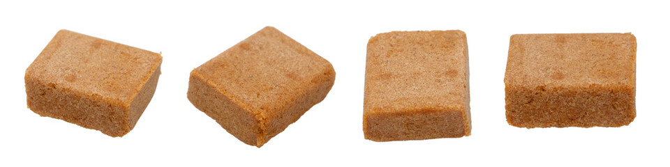 Brown Chicken Soup cubes, Set of four brown bouillon cubes isolated on white background