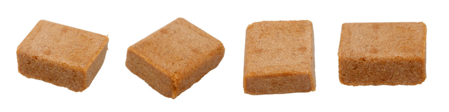 Brown Chicken Soup cubes, Set of four brown bouillon cubes isolated on white background