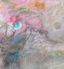 Abstract pink-gray ebru background. Bright iridescences of paint on the water. A creative artistic background for graphic design. Multi-colored shades of colors mixing. Fluid texture. Contemporary art