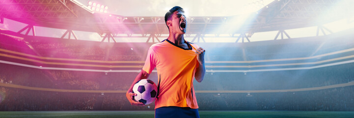 Male football player screaming with passion while holding ball in 3D stadium spotlight. Concept of...