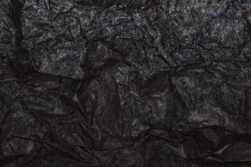 crumpled paper isolated on black background