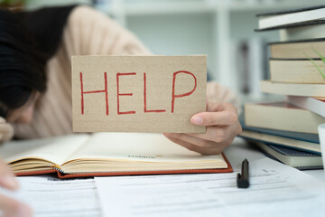 student woman have anxiety because of exams, female hold help in the library. stress, despair, haste, misunderstanding reading, discouraged, expectation, knowledge