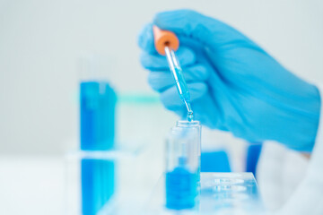 Scientist analyze biochemical samples in advanced scientific laboratory. Medical professional use...