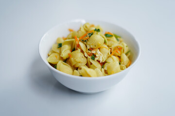 Italian Cuisine: Vegetable Pasta in White Bowl, Studio Shot on White