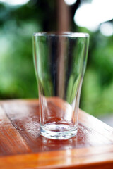 glass of cup on wooden table. closeup image