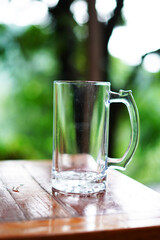 empty glass of beer mug on wooden table