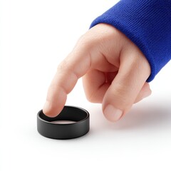 A hand in a blue sleeve touches a black ring